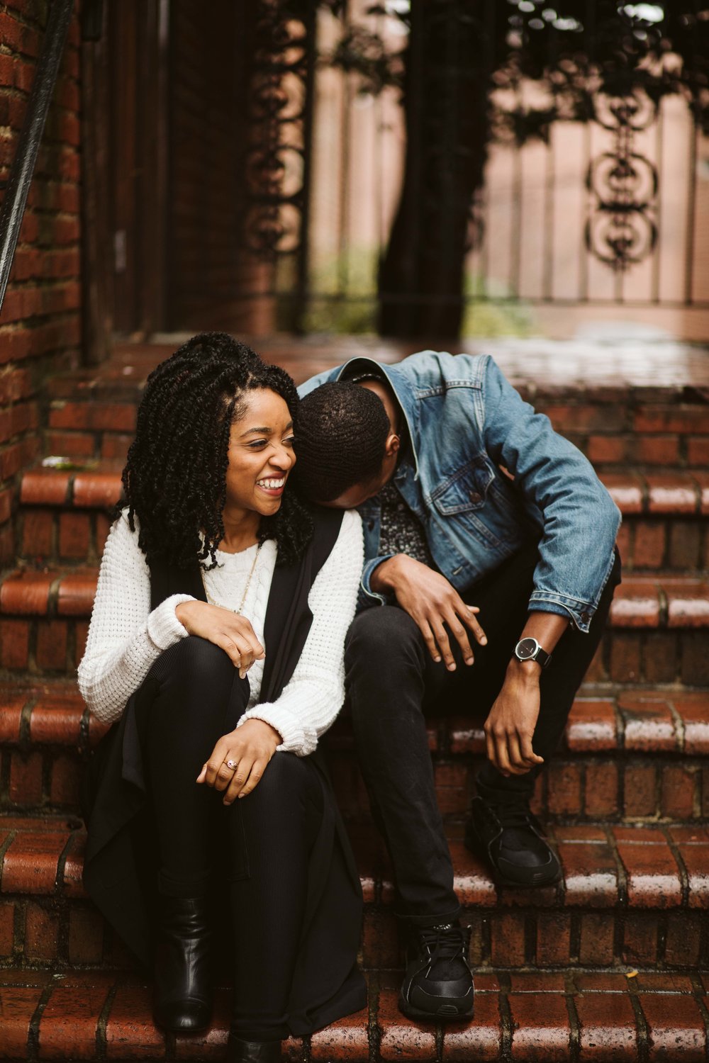  engagement photos with couple sitting on brick stairs 