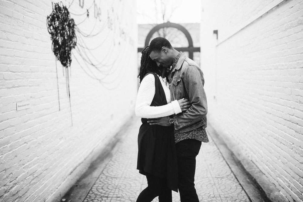  couple hugging in black and white for engagement photo 