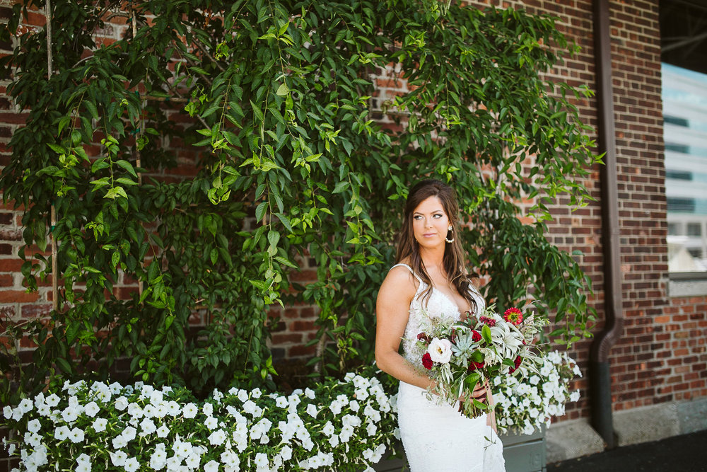  Bridal portrait against a green and brick wall at this Battello Wedding in Jersey City, NJ 