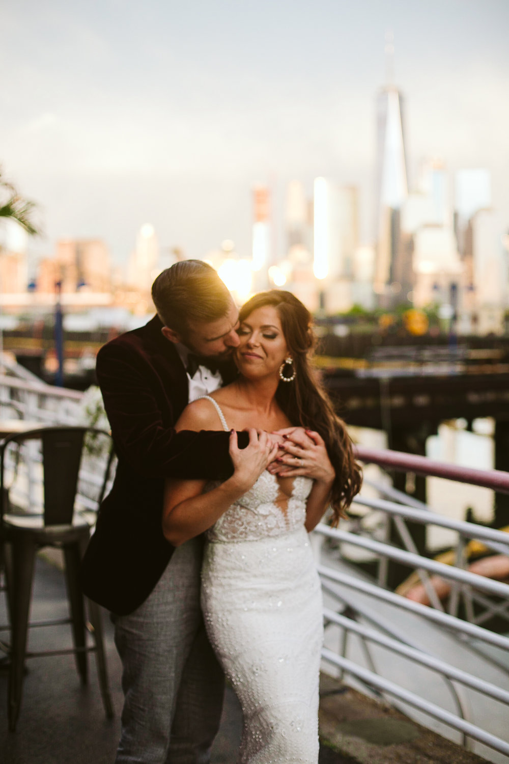  A portrait of the bride and groom with the NYC skyline at sunset at this Battello Wedding in Jersey City, NJ 