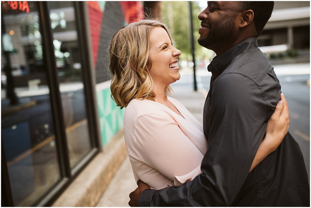 couple hugging in engagement session 