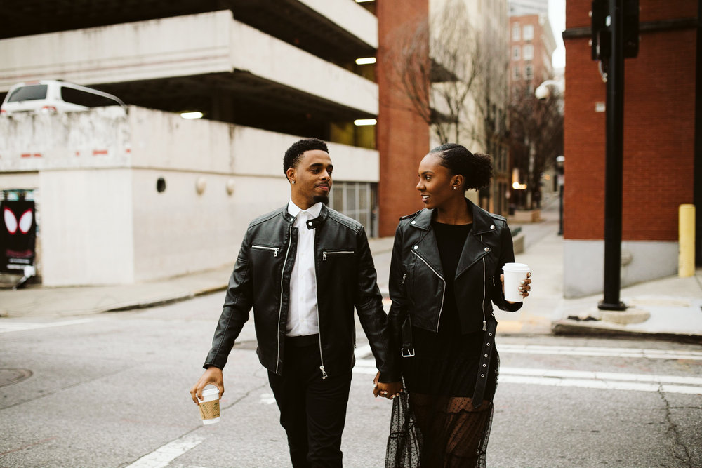  black couple wearing leather for engagement session 