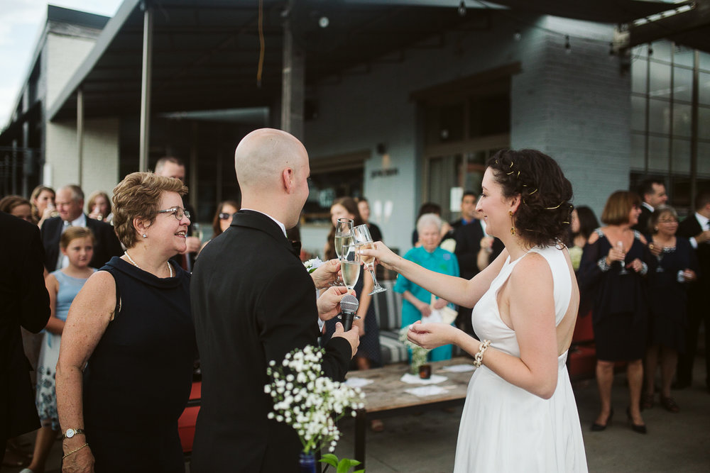  champagne toast at JCT kitchen and bar wedding 