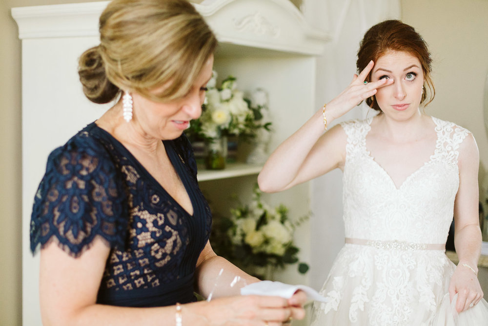  bride and mom cry before wedding day 