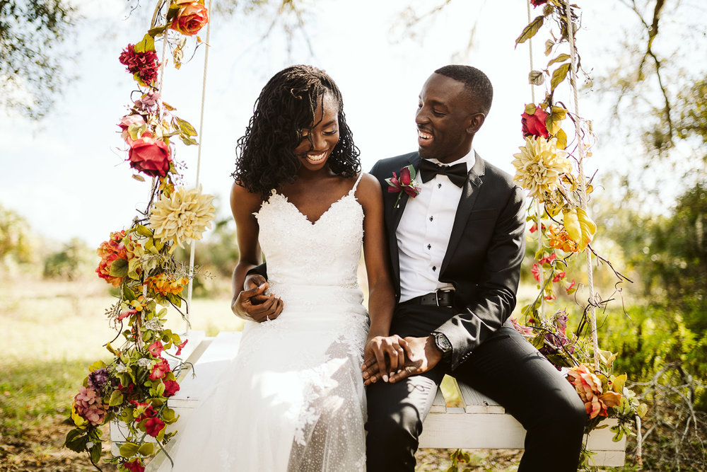  bride and groom on swing at ever after farms 