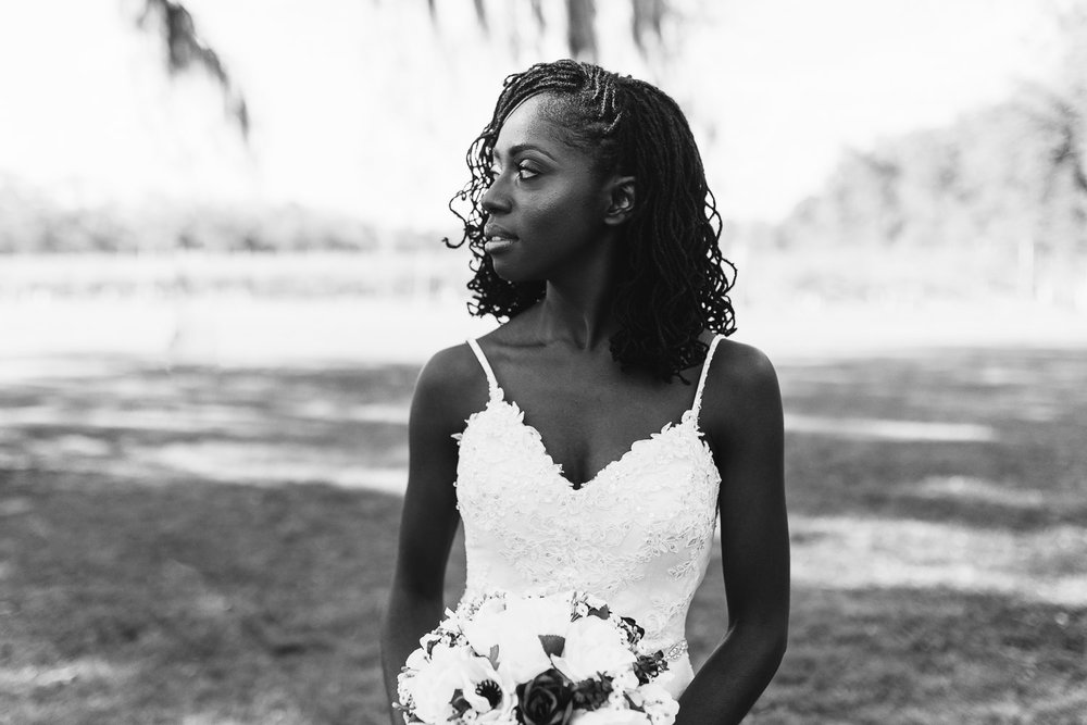  black and white photo of bride with sister locs 