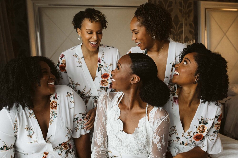  bridesmaids in white robes 