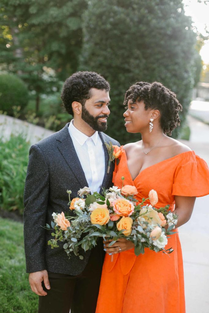 black bride wears orange dress for covid microwedding
