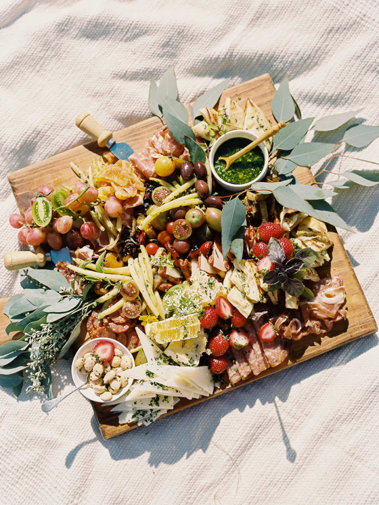 film image of a charcuterie board during a late summer picnic