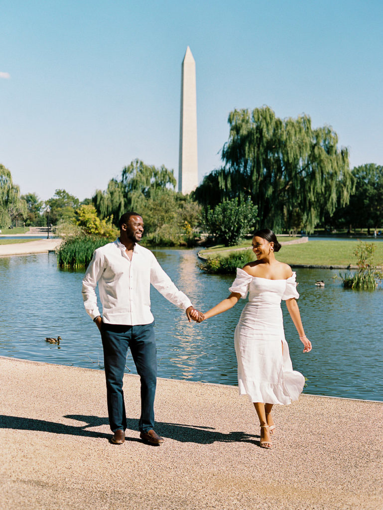 Black couple holding hands in summer at Constitution Gardens by Film photographer Kiyah C Photography