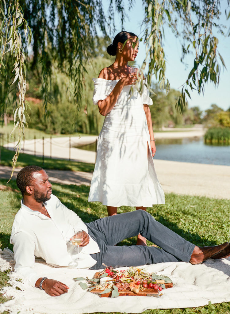 Film image of a black couple enjoying a summer picnic in Washington DC