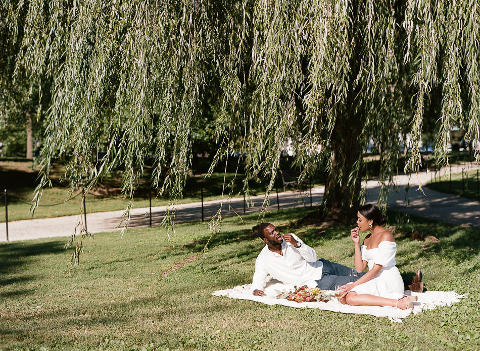 Film image of a black couple enjoying a summer picnic in Constitution Gardens