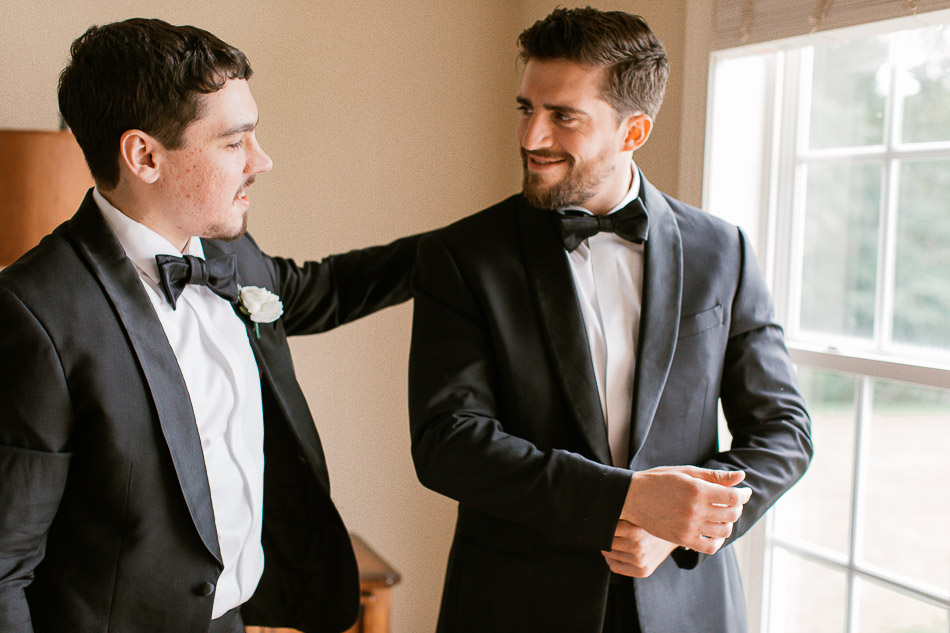 Groom and best man getting dressed