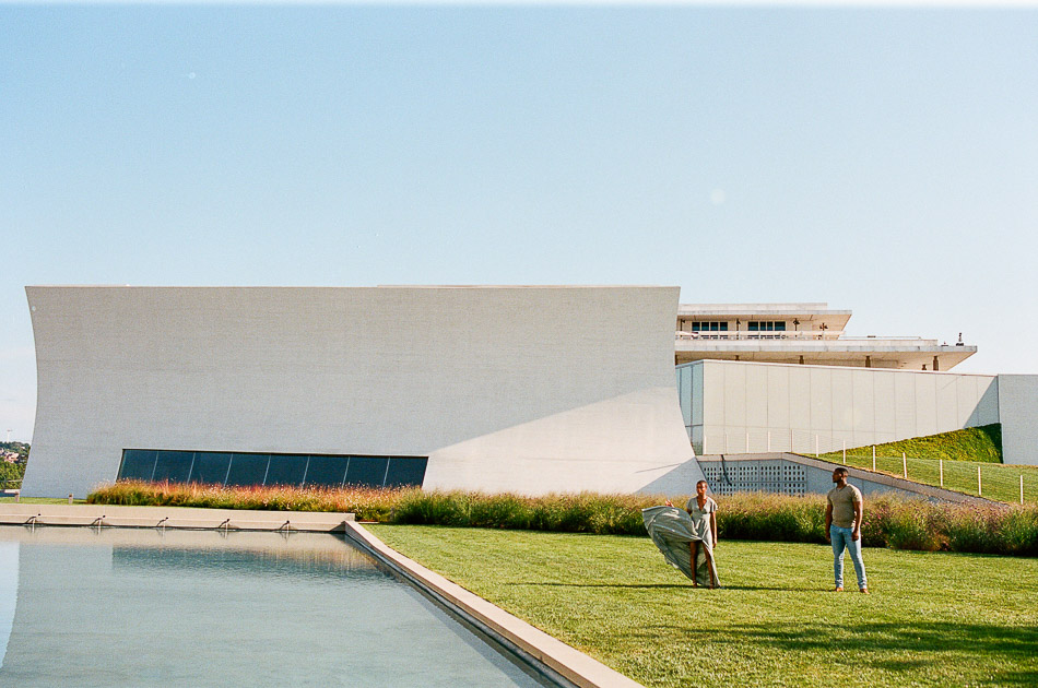 Exterior view of the sunrise at DC Kennedy Center with a black couple standing in front