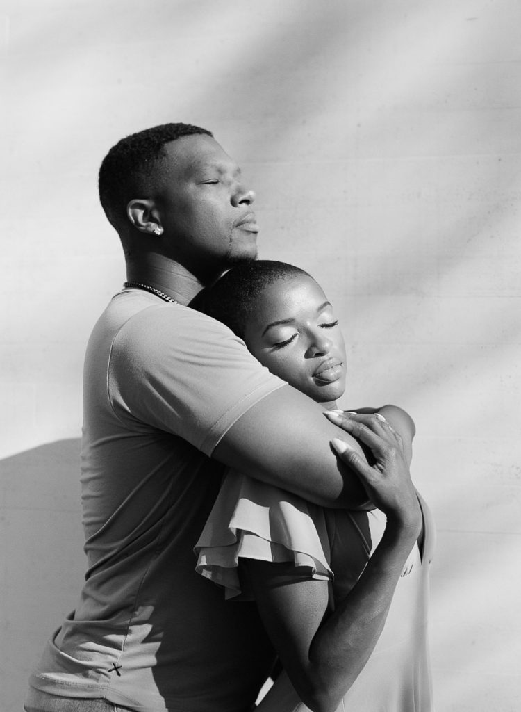 Black and white photo of a young black couple at sunrise at dc kennedy center