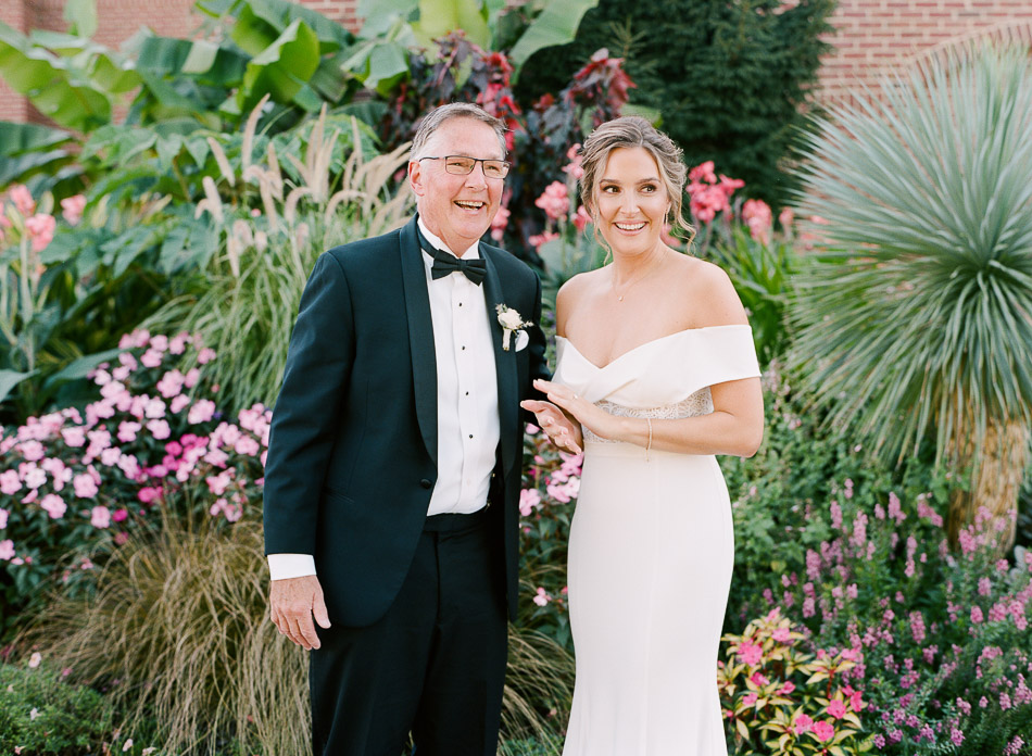 bride and dad smiling on wedding day