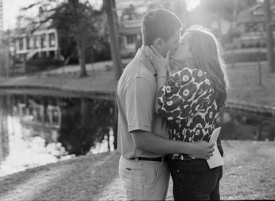 black and white photo of couple kissing during atlanta engagement session