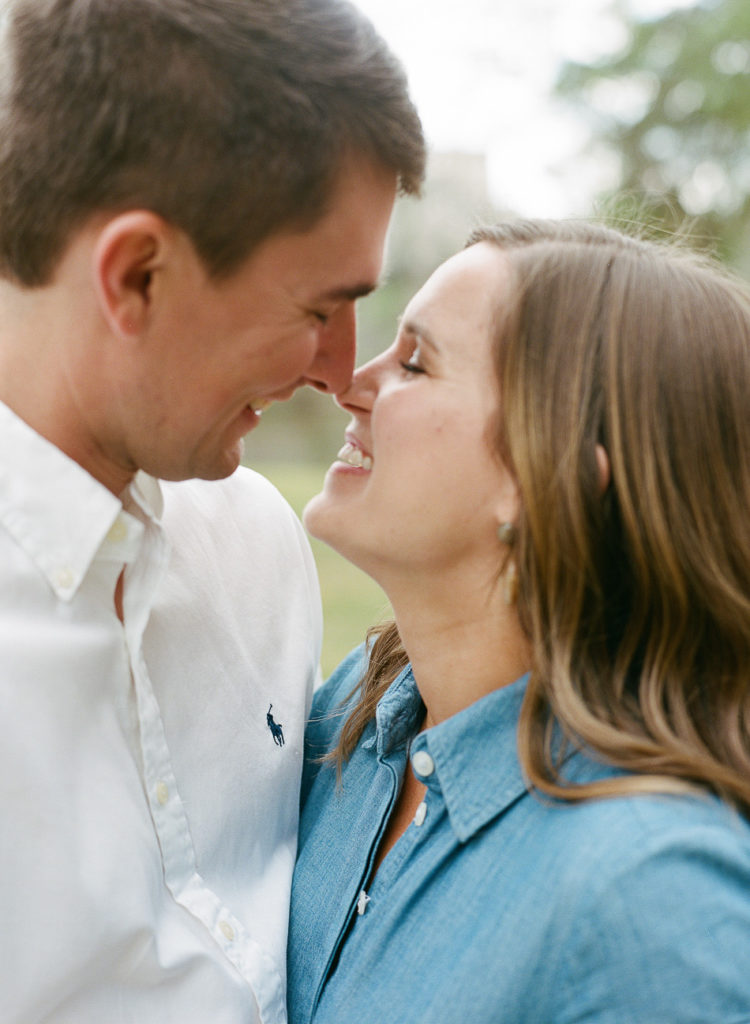 couple cuddling noses during engagement session