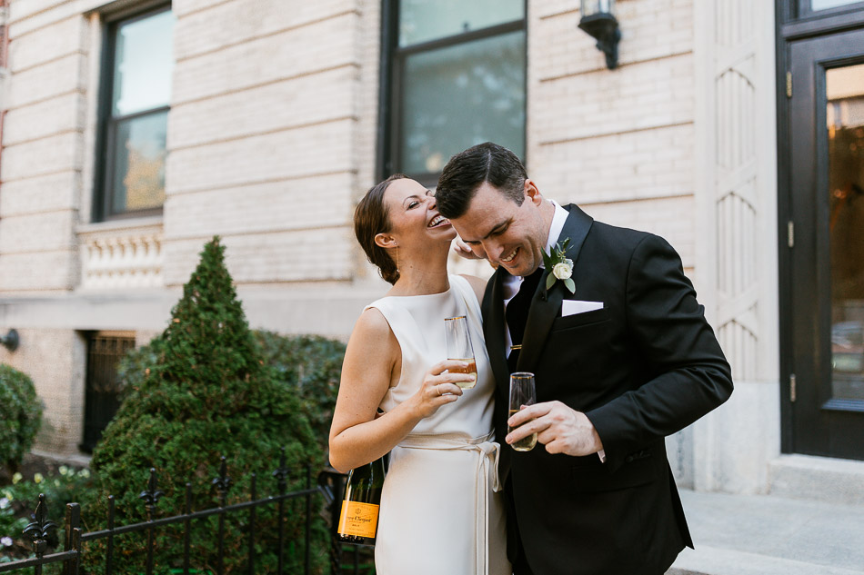Veuve Clicquot toast by the bride and groom at  intimate wedding at the national cathedral