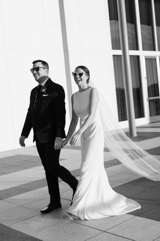bride and groom wearing sunglasses at  intimate wedding at the national cathedral